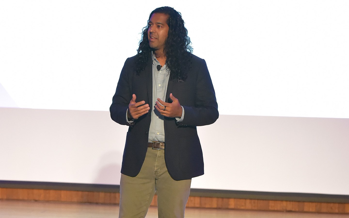 Man presenting in front of crowd