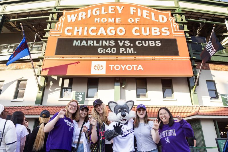 Students and Willie in front of Wrigley Field